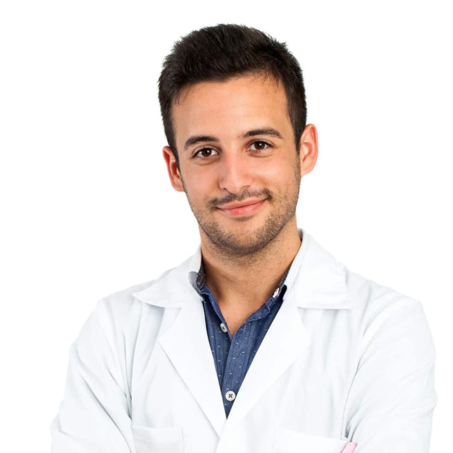 Close up portrait of young male doctor isolated on white background.